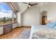 Bedroom featuring a beautiful view, wood flooring, custom radiator cover and elegant furniture at 23 Verde Ct, Breckenridge, CO 80424