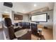 Home theater with reclining leather seats, a mini bar and a large screen at 23 Verde Ct, Breckenridge, CO 80424
