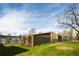 Unique architecture with modern lines and an enclosed walkway surrounded by a manicured lawn at 675 S University Blvd # 106, Denver, CO 80209