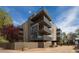 Contemporary condo building featuring multiple balconies and a landscaped exterior at 675 S University Blvd # 106, Denver, CO 80209