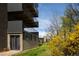 Building features private patio and balconies, surrounded by greenery at 675 S University Blvd # 106, Denver, CO 80209