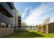 Well-manicured lawn surrounding modern building with connecting glass walkway at 675 S University Blvd # 106, Denver, CO 80209