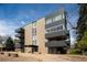 Modern building showcasing sleek architecture with private balconies and manicured grounds at 675 S University Blvd # 106, Denver, CO 80209