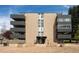 Modern apartment building featuring balconies and nicely landscaped grounds in a sunny setting at 675 S University Blvd # 106, Denver, CO 80209