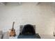 Close up of the painted brick fireplace that adds character to this home at 675 S University Blvd # 106, Denver, CO 80209