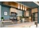 Modern kitchen with stainless steel appliances, pendant lighting, and ample counter space at 675 S University Blvd # 106, Denver, CO 80209