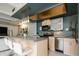 Modern kitchen features stainless steel appliances, a breakfast bar, and stylish pendant lighting at 675 S University Blvd # 106, Denver, CO 80209