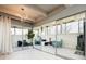 Modern living room boasts contemporary lighting and sliding glass doors with outside views at 675 S University Blvd # 106, Denver, CO 80209