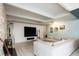 Living room showcases open concept, modern design, and painted brick fireplace at 675 S University Blvd # 106, Denver, CO 80209