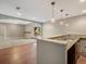 Basement bar featuring granite countertops, a sink, and views of the recreational space at 11545 S Flower Mound Way, Parker, CO 80134