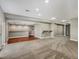 Finished basement with a stylish bar area featuring pendant lighting and wood flooring at 11545 S Flower Mound Way, Parker, CO 80134