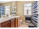 Bathroom with dual vanity, modern fixtures, blue striped shower curtain and natural light at 11545 S Flower Mound Way, Parker, CO 80134