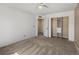 Neat bedroom with ceiling fan and closet with built-ins at 11545 S Flower Mound Way, Parker, CO 80134