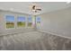 Bright bedroom with multiple windows that brings natural light into the space at 11545 S Flower Mound Way, Parker, CO 80134