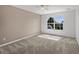 Clean bedroom with neutral walls and a large window at 11545 S Flower Mound Way, Parker, CO 80134