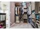 This walk-in closet has custom shelving for maximum storage and organization at 11545 S Flower Mound Way, Parker, CO 80134