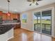 Well-equipped kitchen with wood cabinets, stainless appliances, and backyard views at 11545 S Flower Mound Way, Parker, CO 80134