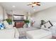 Cozy living room features stylish seating, an entertainment center, and natural light at 11545 S Flower Mound Way, Parker, CO 80134