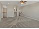 Upstairs loft with neutral colored carpet, modern ceiling fan, and view of the downstairs area at 11545 S Flower Mound Way, Parker, CO 80134