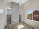 Upstairs loft with carpet flooring, view of staircase with iron spindles, and lots of natural light at 11545 S Flower Mound Way, Parker, CO 80134