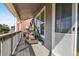 Relaxing covered porch with a porch swing, offering a cozy outdoor seating area, and a screen door at 11545 S Flower Mound Way, Parker, CO 80134