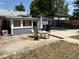 Backyard area with a concrete patio, perfect for outdoor dining and relaxation at 1337 Valentia St, Denver, CO 80220