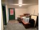Basement storage area with a door and space for organizing household belongings at 1337 Valentia St, Denver, CO 80220