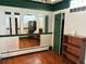 A cozy bedroom with hardwood floors, decorative mirrors, and a built in bookshelf at 1337 Valentia St, Denver, CO 80220