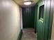Hallway with green trim and paneled wall, leading to other areas of the home at 1337 Valentia St, Denver, CO 80220