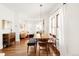 Inviting dining room with hardwood floors and ample natural light from large windows at 3534 Decatur St, Denver, CO 80211