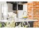 Modern kitchen featuring white countertops, stainless steel appliances, and sleek dark cabinets at 3534 Decatur St, Denver, CO 80211