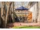 Charming patio with a dining table, umbrella, and grill, great for entertaining at 3534 Decatur St, Denver, CO 80211