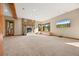 Expansive basement with stone fireplace, wooden beams, ample natural light, and outdoor views at 91 Hess Ave, Golden, CO 80401