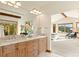 Bright bathroom features a double sink vanity with a neutral tile countertop and scenic outdoor views at 91 Hess Ave, Golden, CO 80401