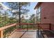 Exterior deck overlooking lush, green trees and mountain views at 91 Hess Ave, Golden, CO 80401