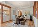 Elegant dining room featuring a unique wooden table, decorative mirror, and light-filled space with mountain views at 91 Hess Ave, Golden, CO 80401
