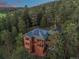 Beautiful two-story home with a green roof, solar panels, and a wrap-around driveway at 91 Hess Ave, Golden, CO 80401