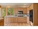 Charming kitchen featuring sleek appliances, custom cabinetry, and a bright window offering a serene outdoor view at 91 Hess Ave, Golden, CO 80401