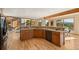 Open kitchen with counter seating, updated appliances, and a seamless connection to the mountain views at 91 Hess Ave, Golden, CO 80401