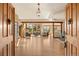 Bright, open-concept living room showcasing hardwood floors, large windows with scenic views, and modern furnishings at 91 Hess Ave, Golden, CO 80401