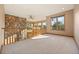 Spacious loft area with stone accents, large windows, and natural light, perfect for relaxing at 91 Hess Ave, Golden, CO 80401