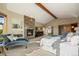 Serene main bedroom with a stone fireplace, chaise lounge, and access to an en-suite bathroom at 91 Hess Ave, Golden, CO 80401