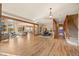 Bright open floorplan with hardwood floors, living space, kitchen, dining area, and stairs at 91 Hess Ave, Golden, CO 80401