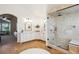 Spacious bathroom with a walk-in glass shower, white cabinets, and tile floors at 3970 White Bay Dr, Highlands Ranch, CO 80126