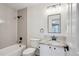 Bathroom featuring white subway tile, granite countertops and matte black hardware at 3970 White Bay Dr, Highlands Ranch, CO 80126