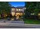 Beautifully landscaped front yard of home with mature trees and inviting entryway at 3970 White Bay Dr, Highlands Ranch, CO 80126