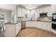 Beautiful kitchen featuring white cabinets, stainless steel appliances, and granite countertops at 3970 White Bay Dr, Highlands Ranch, CO 80126