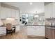 Spacious kitchen with granite countertops, white cabinets, stainless steel appliances and an office nook at 3970 White Bay Dr, Highlands Ranch, CO 80126