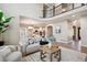 Open-concept living room with hardwood floors and easy access to the kitchen at 3970 White Bay Dr, Highlands Ranch, CO 80126
