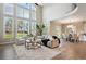 Bright living room with soaring windows, hardwood floors, and an open floor plan at 3970 White Bay Dr, Highlands Ranch, CO 80126